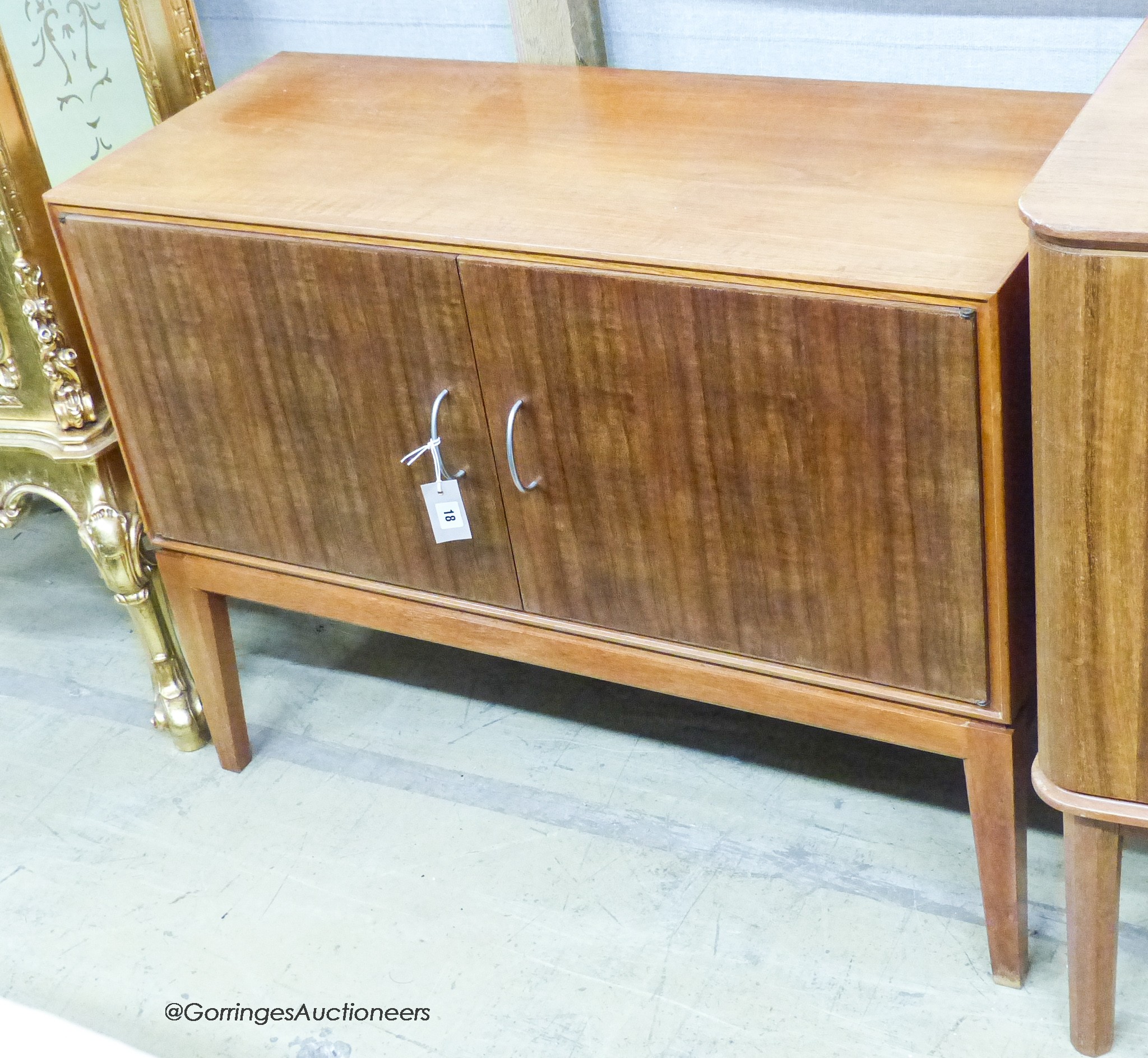 A Gordon Russell Ltd teak and Indian laurel 2 door side cabinet, model R 803 circa 1960, length 101cm, depth 42cm, height 77cm